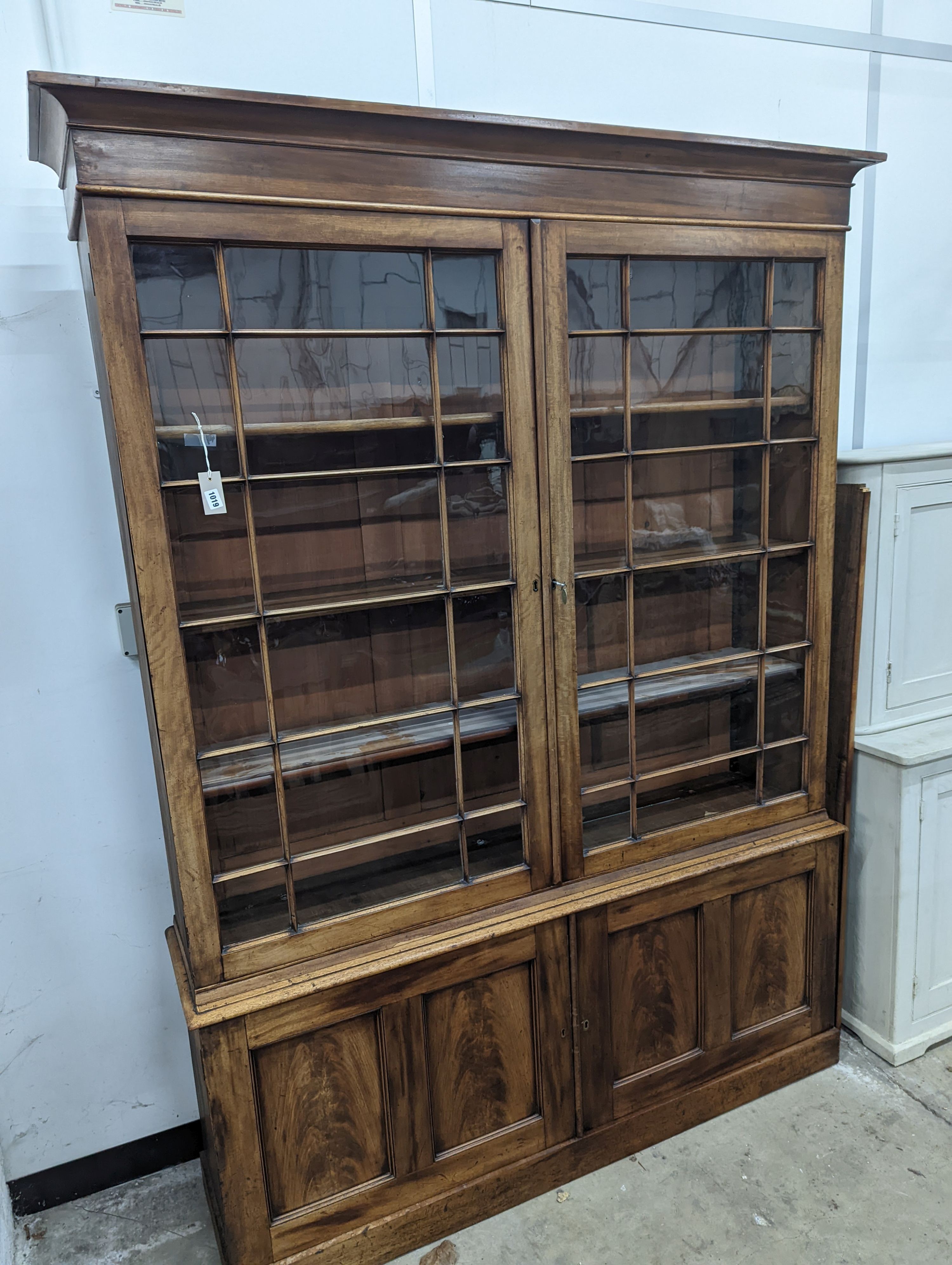 A George III style mahogany library bookcase, width 154cm, depth 38cm, height 217cm
